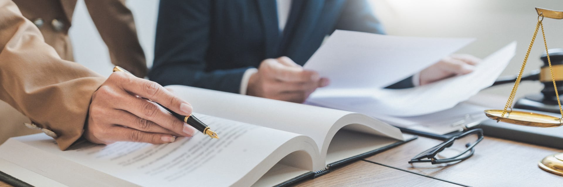 Attorney reviewing legal documents at a desk
