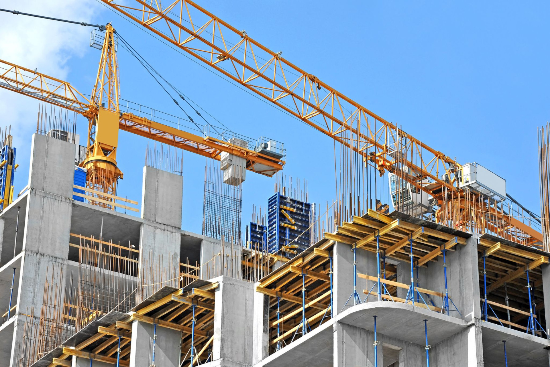 Building under construction with tower cranes