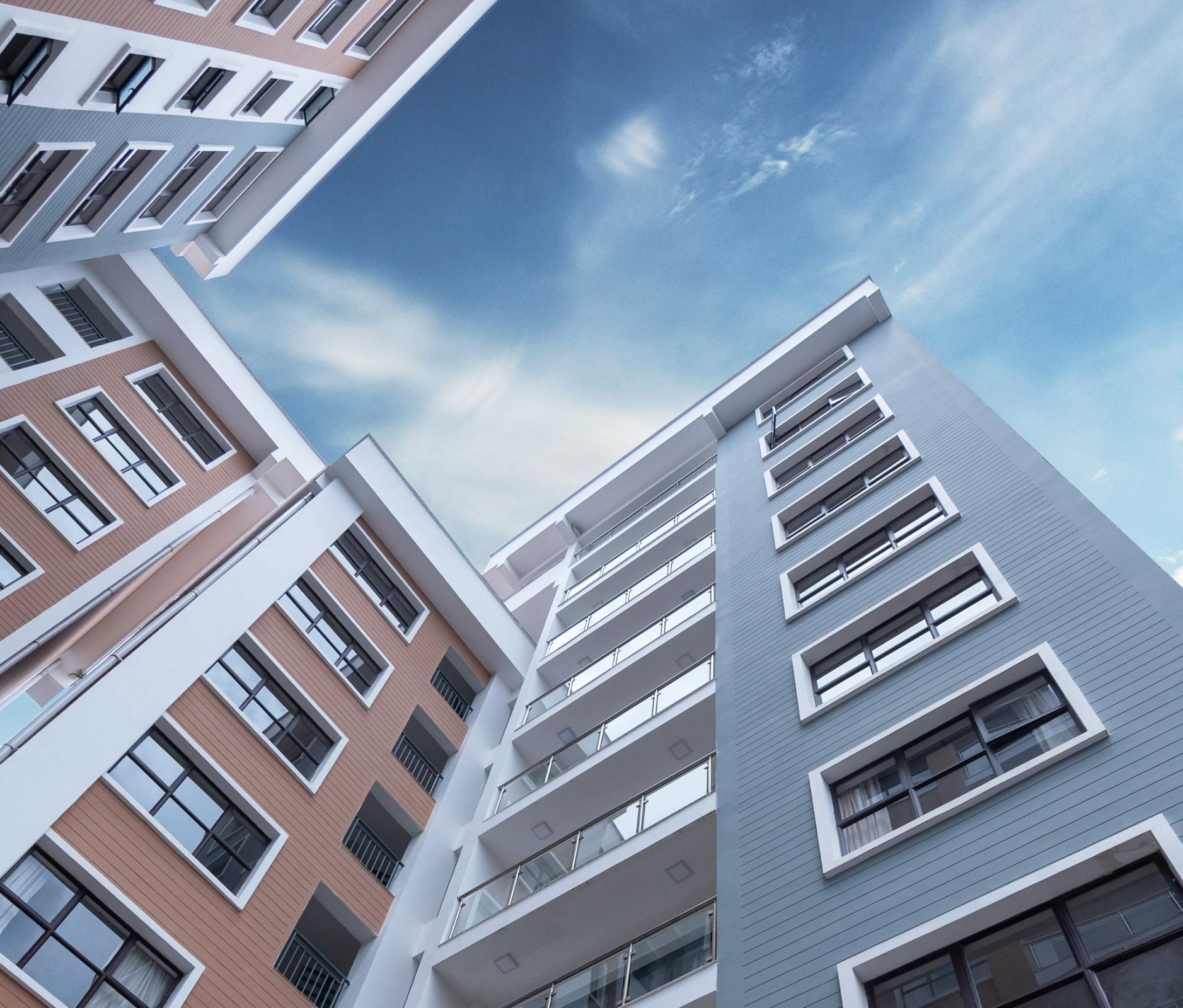 Modern residential building against a blue sky