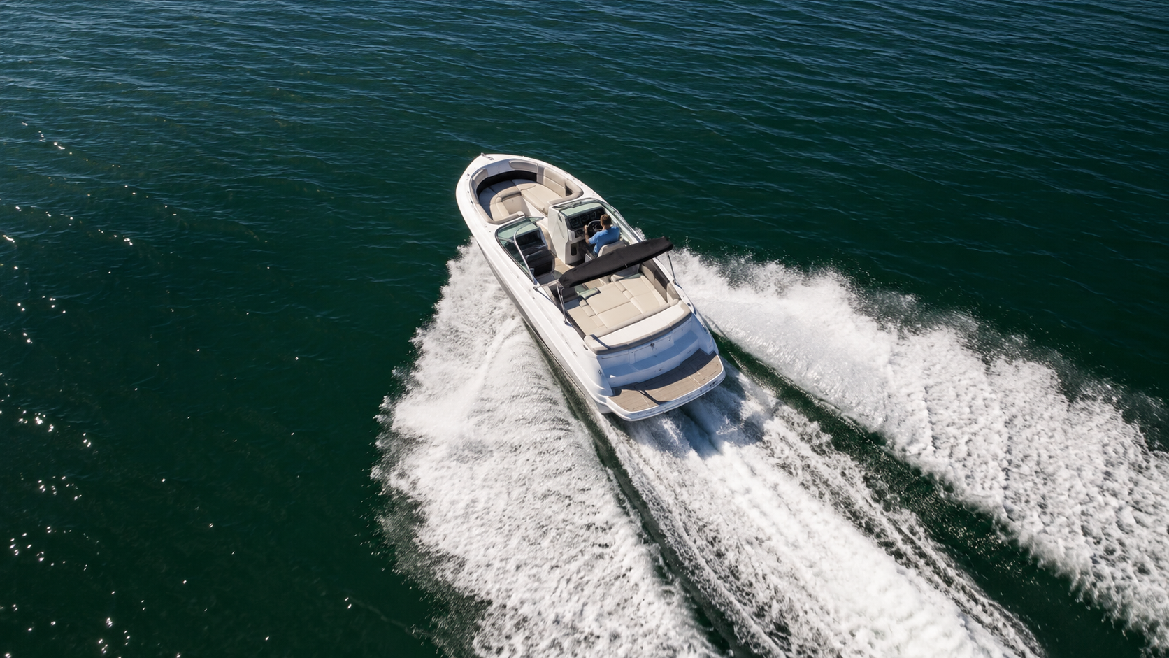 Speedboat cutting across open water