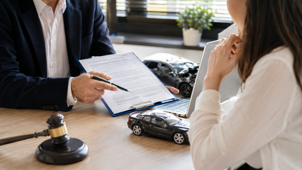 Attorney reviewing paperwork with a client after a minor accident