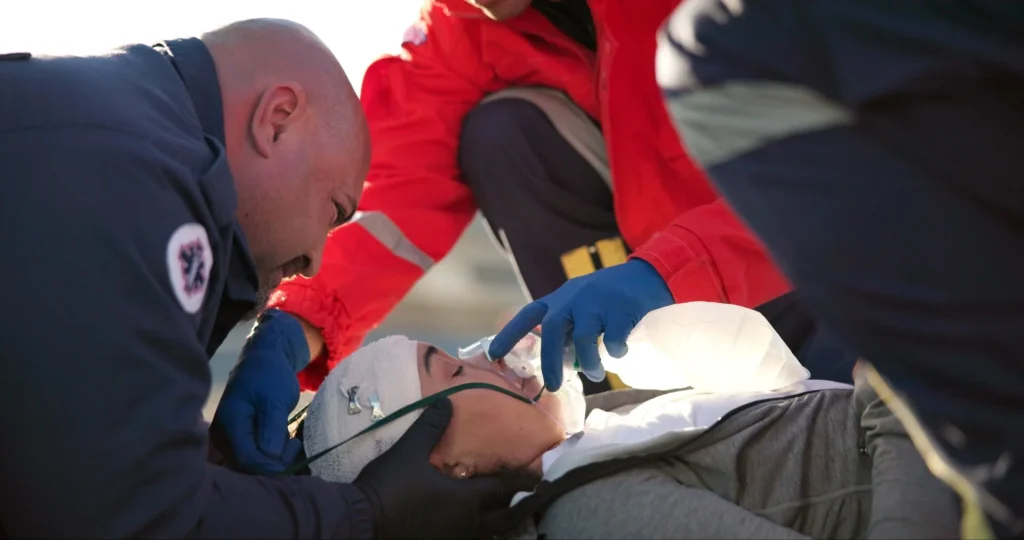 Paramedics treating an injured motorcyclist
