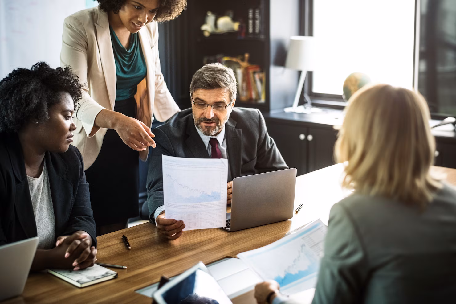 Business team reviewing documents at a meeting